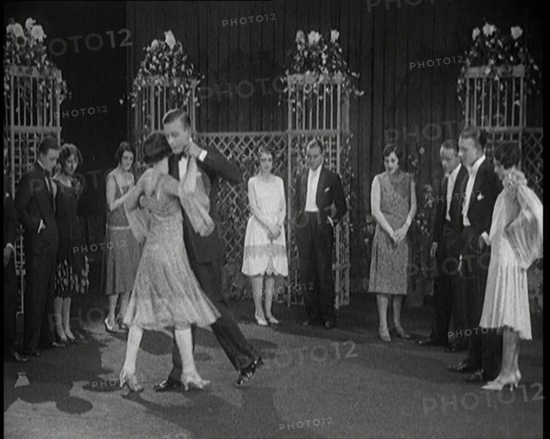A Group of People Dancing the Charleston. One Female Civilian is Rubbing Her Legs is Pain, 1926. Creator: British Pathe Ltd.