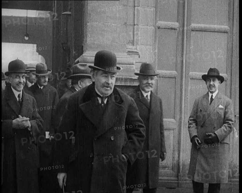 The French Prime Minister Aristide Briand Standing Outside with a Group of Male Civilians..., 1926. Creator: British Pathe Ltd.