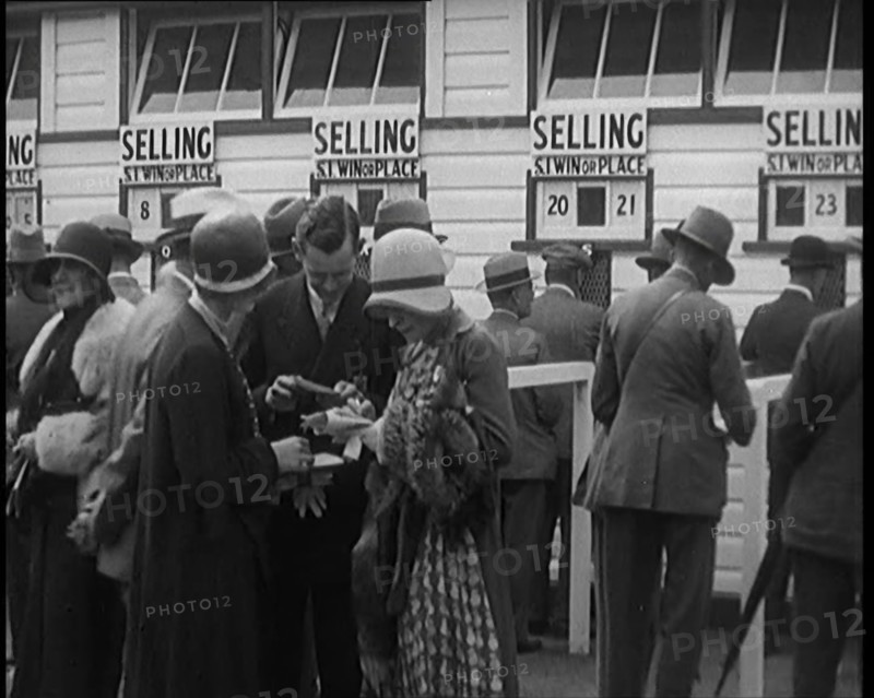 A Crowd of People Standing Outside a Totaliser/Tote Office at a Horse Race Course..., 1929. Creator: British Pathe Ltd.