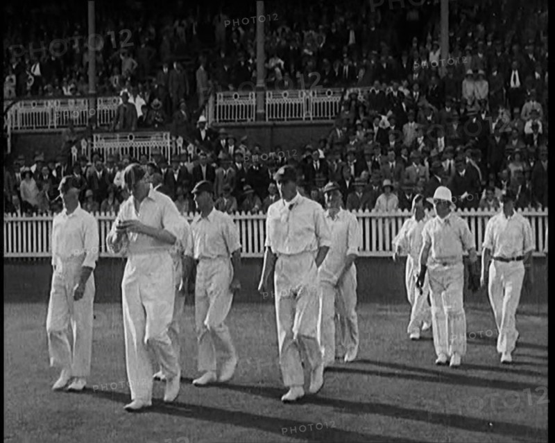 The English Cricket Team Coming Out to Play in Ashes Test in Front of a Large Crowd, 1929. Creator: British Pathe Ltd.