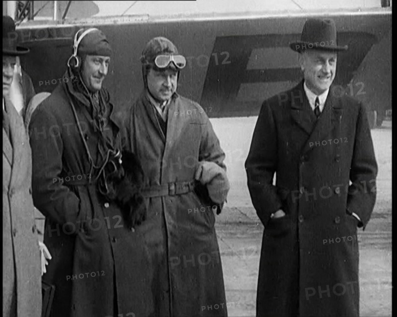 Four Male Civilians Standing in Front of a Plane, 1929. Creator: British Pathe Ltd.