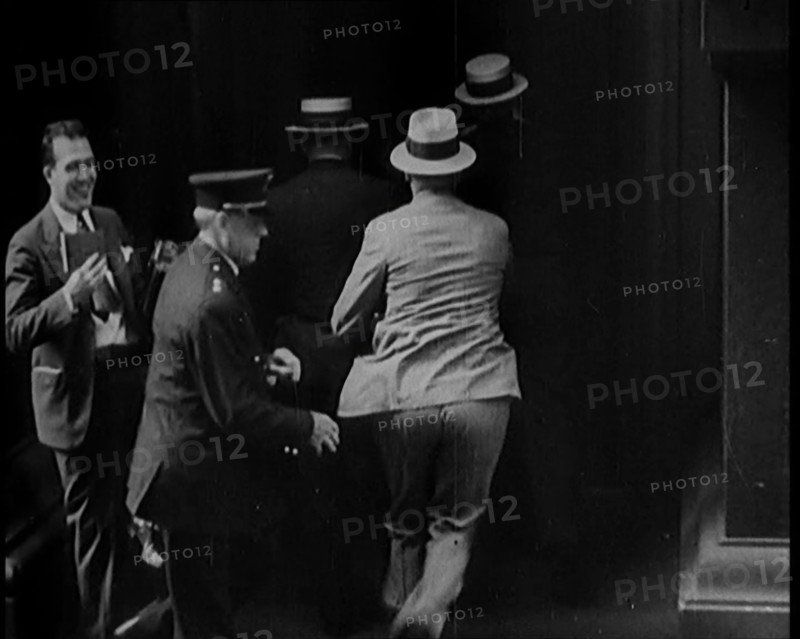 Male Civilians Walking in to a Building, 1929. Creator: British Pathe Ltd.