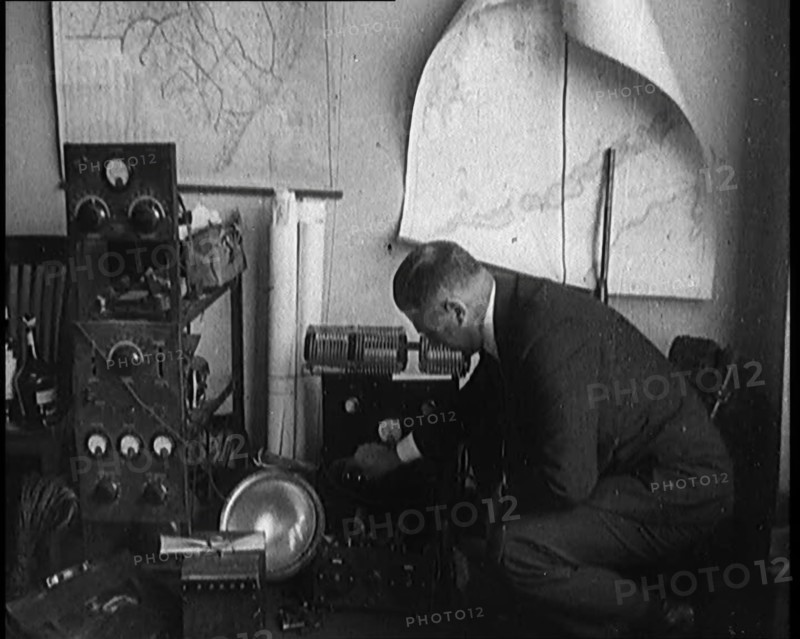 Male Detective Showing off Smugglers' Radio Equipment, 1929. Creator: British Pathe Ltd.