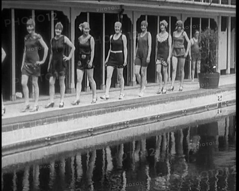 A Group of Young Female Civilians Wearing Short Swimsuits and Heeled Shoes Emerging from..., 1920. Creator: British Pathe Ltd.