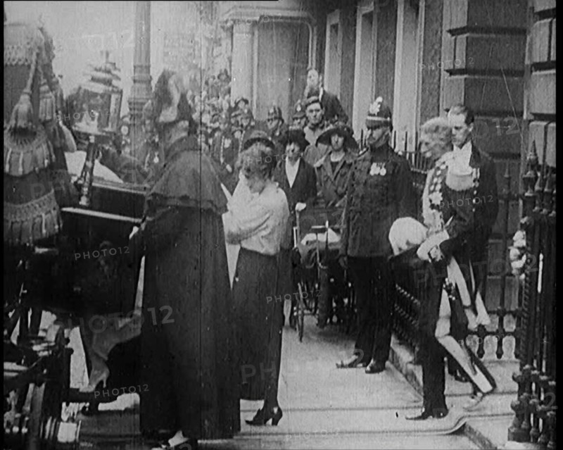 The Duke of York and Lady Elizabeth Bowes-Lyon Emerging from a House and Embarking on a..., 1920. Creator: British Pathe Ltd.
