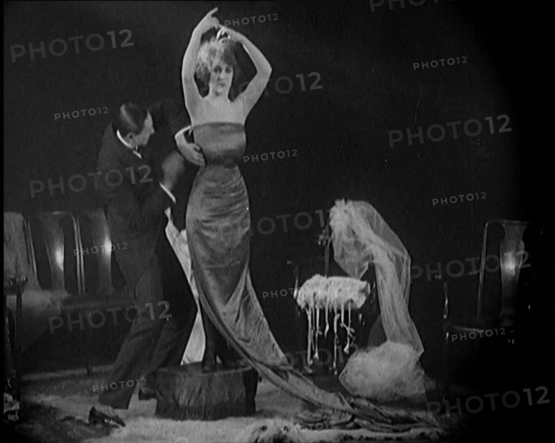 Alphonse Berge, Famous Fashion Designer,  Constructing a Dress, a Female Civilian Model..., 1920. Creator: British Pathe Ltd.