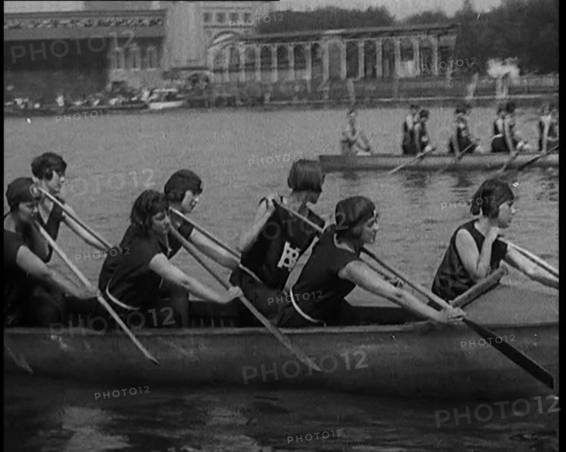 Young Female Civilians Wearing a Team Sport Outfit in a Rowing Race, an Audience Is Seen on..., 1920 Creator: British Pathe Ltd.