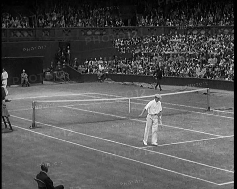 Two Male Civilians Playing a Match of Tennis at Centre Court at the All England Lawn Tennis..., 1920 Creator: British Pathe Ltd.