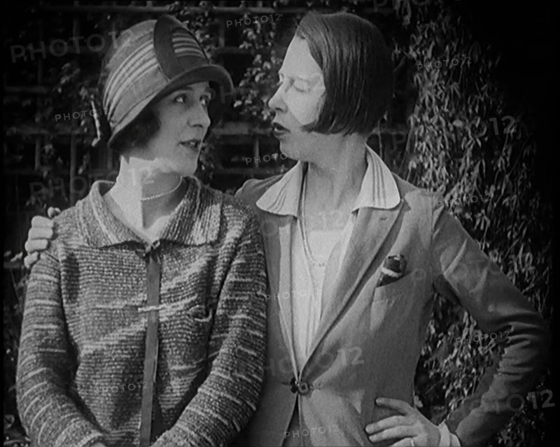 British Artists Norah Blaney and Gwen Farrah Posing for the Camera Smiling at Each Other, 1920. Creator: British Pathe Ltd.