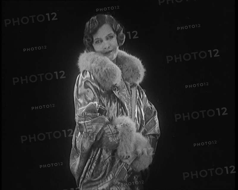 Female Civilian Modelling a Glamorous Fur Trimmed Coat, 1920. Creator: British Pathe Ltd.
