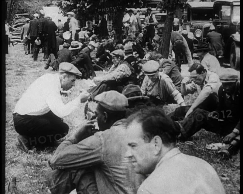 Large Crowd of American Civilians Eating Meals Outdoors, 1930. Creator: British Pathe Ltd.