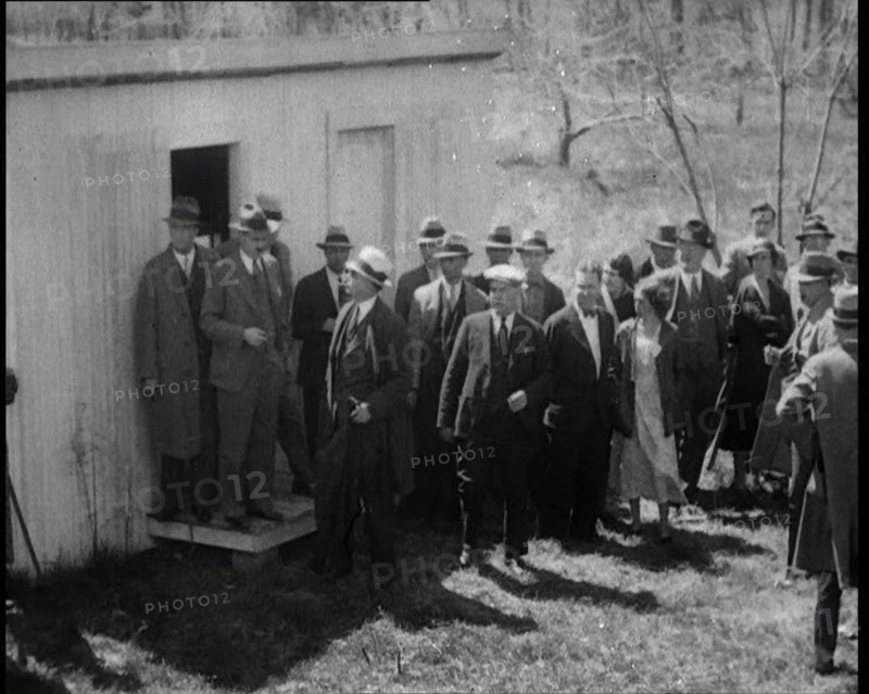 American Police Officers and Civilians in a Cemetery During a Kidnapping Investigation, 1930s. Creator: British Pathe Ltd.