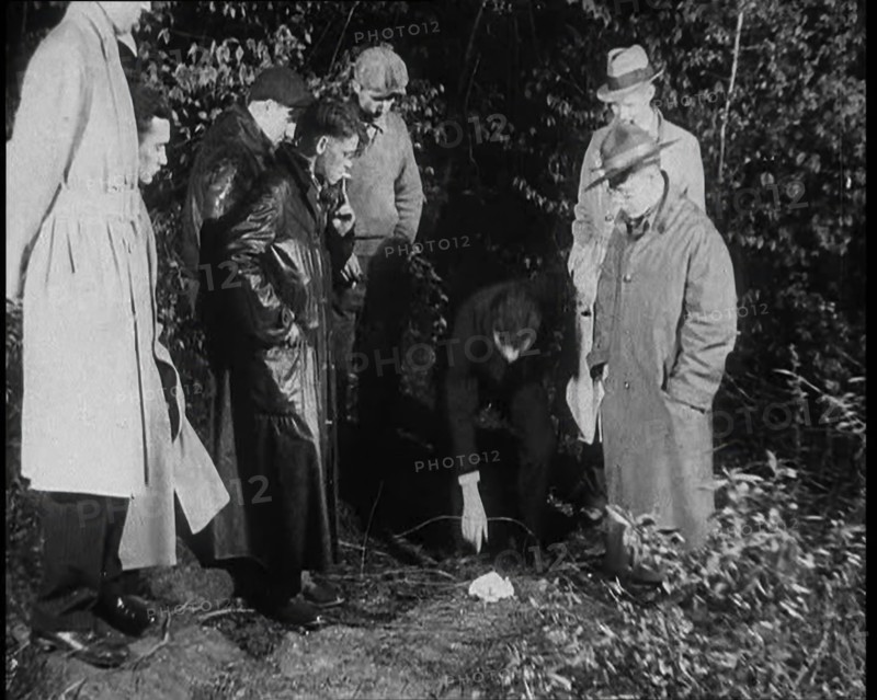 American Police Officers Searching the Area Outside American Aviator Charles Augustus..., 1930s. Creator: British Pathe Ltd.