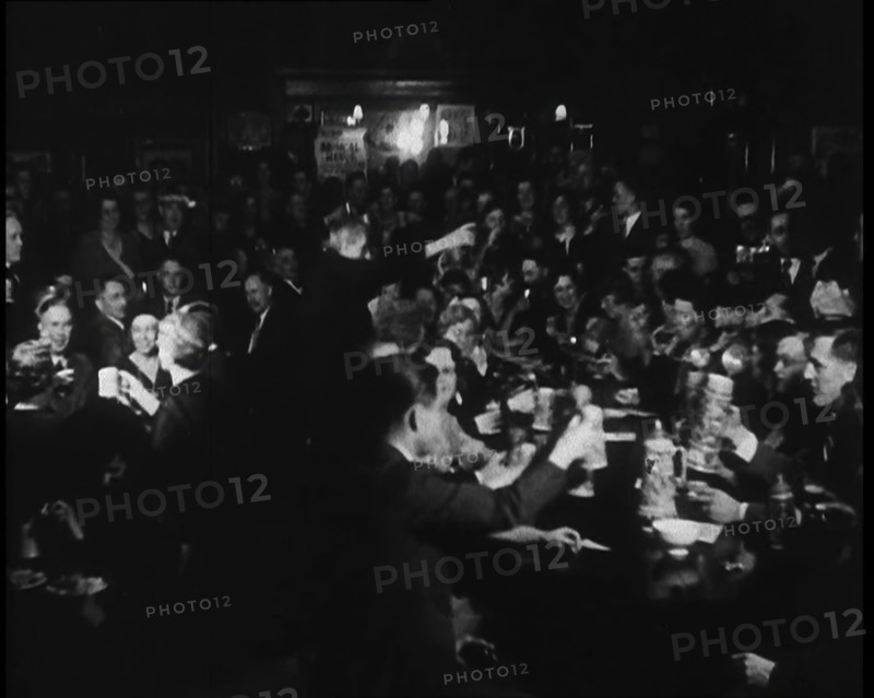 Civilians Drinking in a Bar in Celebration, 1930s. Creator: British Pathe Ltd.