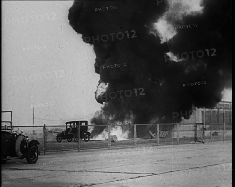 Plume of Flame Burning with Cars Nearby, 1933. Creator: British Pathe Ltd.