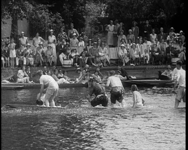 People in Sinking Rowing Boat, Watched by Crowd, 1933. Creator: British Pathe Ltd.