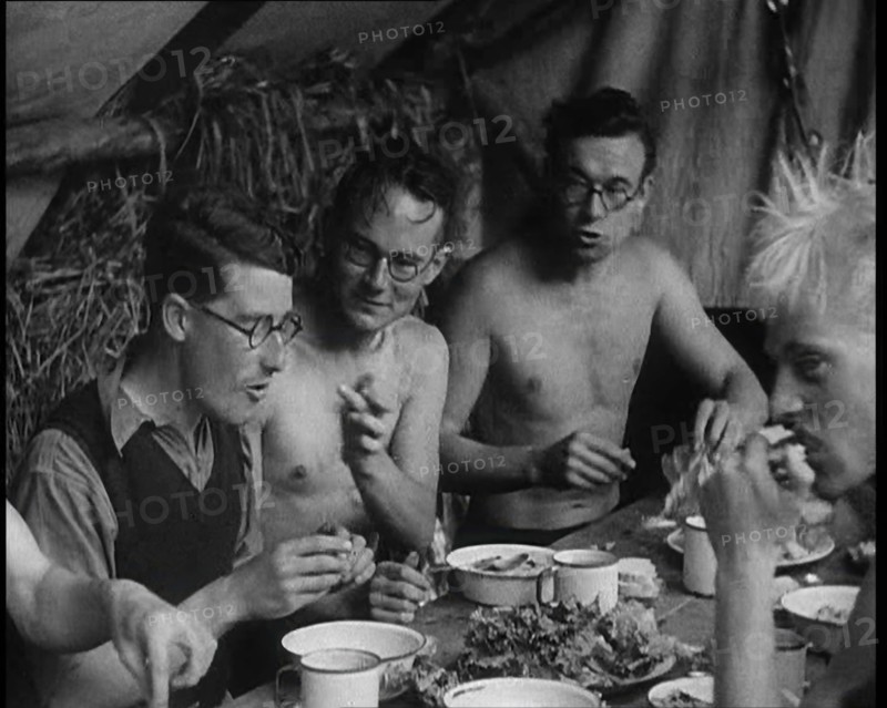 Men Eating Under a Canopy, 1933. Creator: British Pathe Ltd.