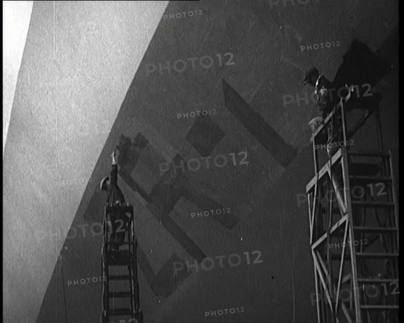 An R 38 Airship Body Being Painted in a Hangar, 1921. Creator: British Pathe Ltd.