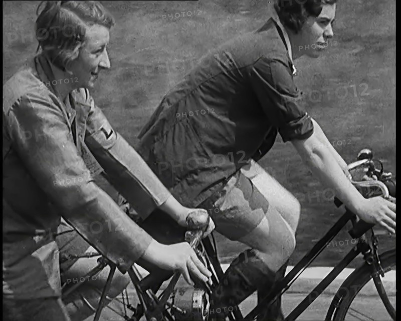 Large Group of Civilians Riding Bicycles Through Country Lanes, 1931. Creator: British Pathe Ltd.