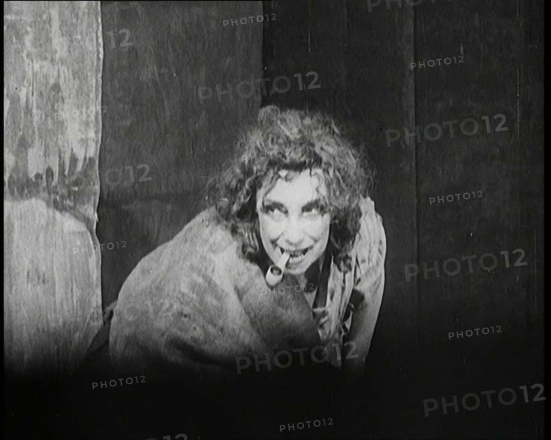Helen Tree Performing in Heavy Makeup and Smoking a Pipe, 1922. Creator: British Pathe Ltd.