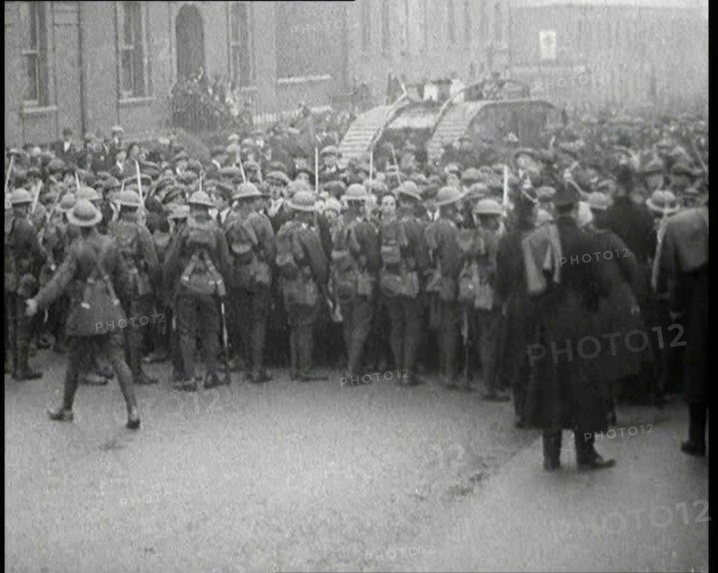 British Soldiers Holding Back Crowds of Demonstrators in Dublin as a Tank Moves Through to..., 1920. Creator: British Pathe Ltd.