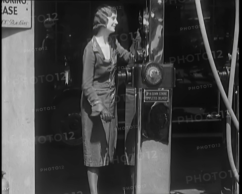 Female Civilians Working Petrol Pumps in a Garage, 1931. Creator: British Pathe Ltd.