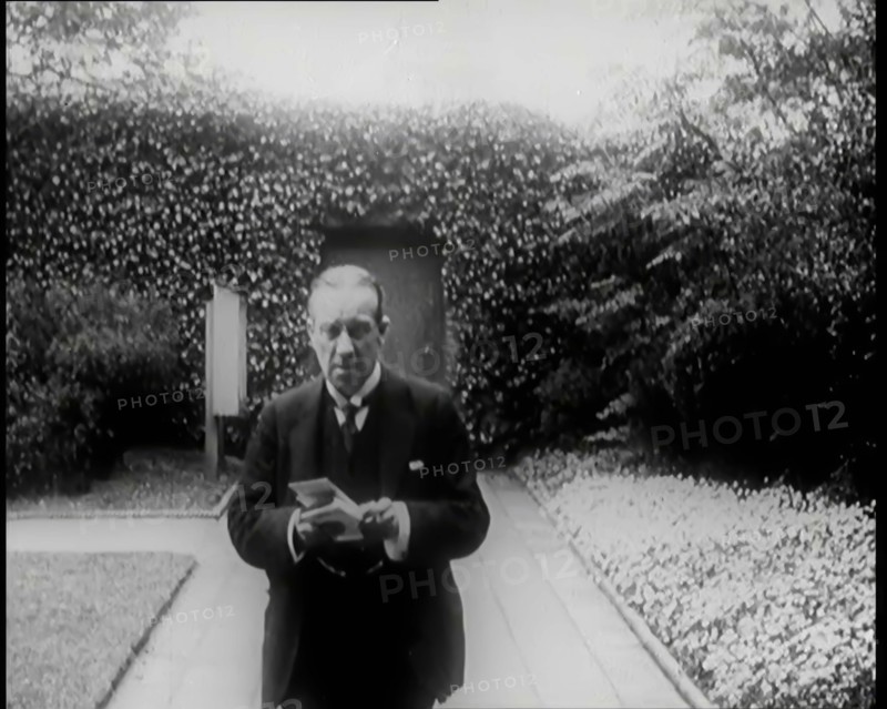 Prime Minister of Britain, Stanley Baldwin, Walking in the Gardens at Chequers Whilst Reading, 1926. Creator: British Pathe Ltd.