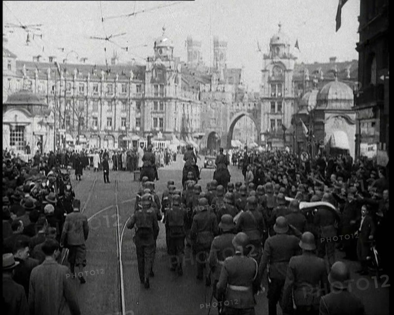 German Soldiers Marching Down a Street as a Crowd Watches, 1930s. Creator: British Pathe Ltd.