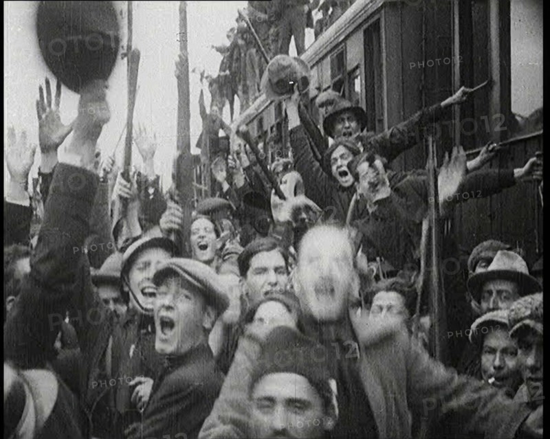 Italian Soldiers Standing on or Near a Train, Waving and Cheering, 1922. Creator: British Pathe Ltd.