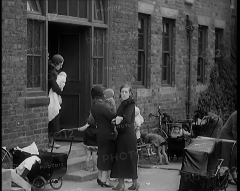Female Civilians and Their Babies at Health Clinics Where the Babies Are Checked by Female..., 1931. Creator: British Pathe Ltd.