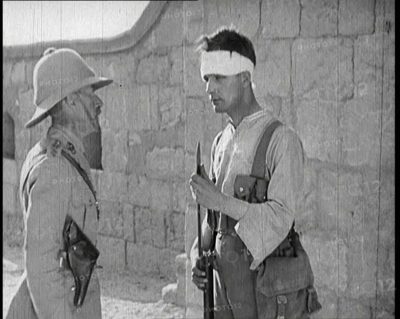 Scene from a Film: Male Actor Playing a Survivor from the Battle Being Questioned..., 1920s. Creator: British Pathe Ltd.