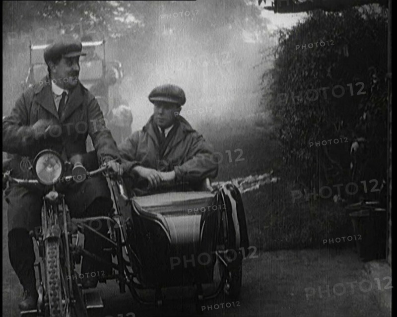 A Motorcycle and Sidecar Pulling up at a Petrol Station for a Refuelling, 1920. Creator: British Pathe Ltd.