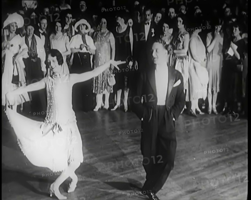 Female Civilian and Male Civilian Dancing in Front of a Crowd of People, 1926. Creator: British Pathe Ltd.