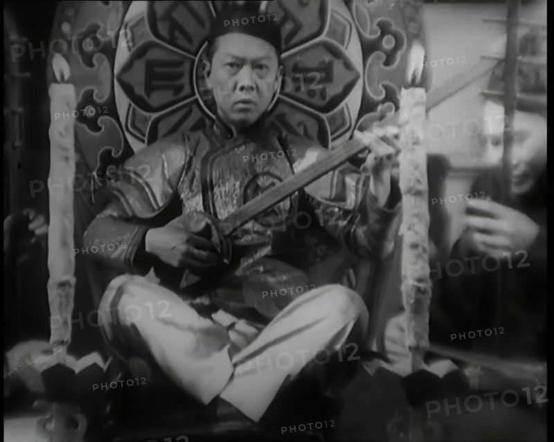 Scene from the Film 'Piccadilly': Male Actor Playing a Lute, 1920s. Creator: British Pathe Ltd.