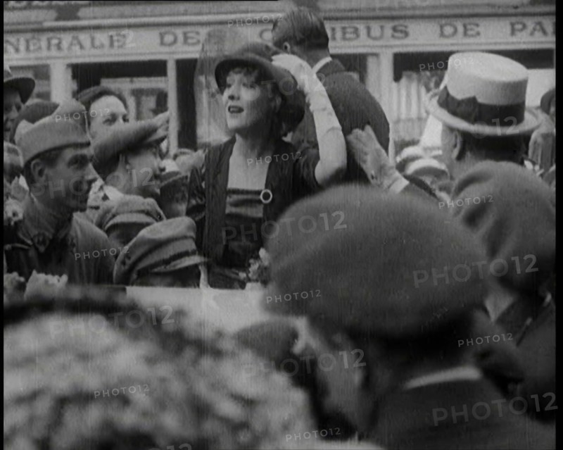 Mary Pickford and Douglas Fairbanks Senior Smiling to Crowds from an Open Topped Car in Paris, 1920. Creator: British Pathe Ltd.