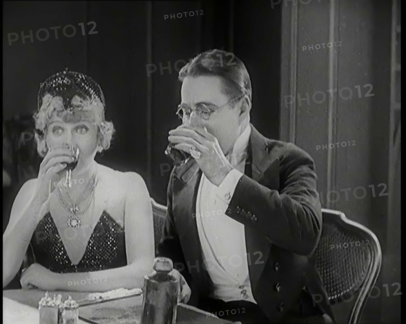 Scene from the Film 'A Little Bit of Fluff': The Female Actor Betty Balfour Sitting at a ..., 1920s. Creator: British Pathe Ltd.