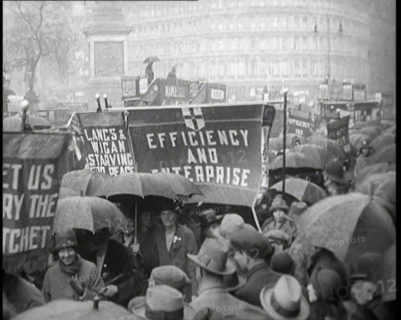 Civilians Demonstrating in London Against Continuous Strikes in the Rain. Signs Read..., 1926. Creator: British Pathe Ltd.