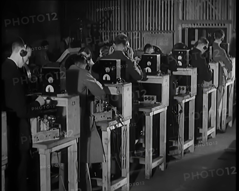 Male Civilians Building Radio Wireless Sets in a Factory, 1931. Creator: British Pathe Ltd.