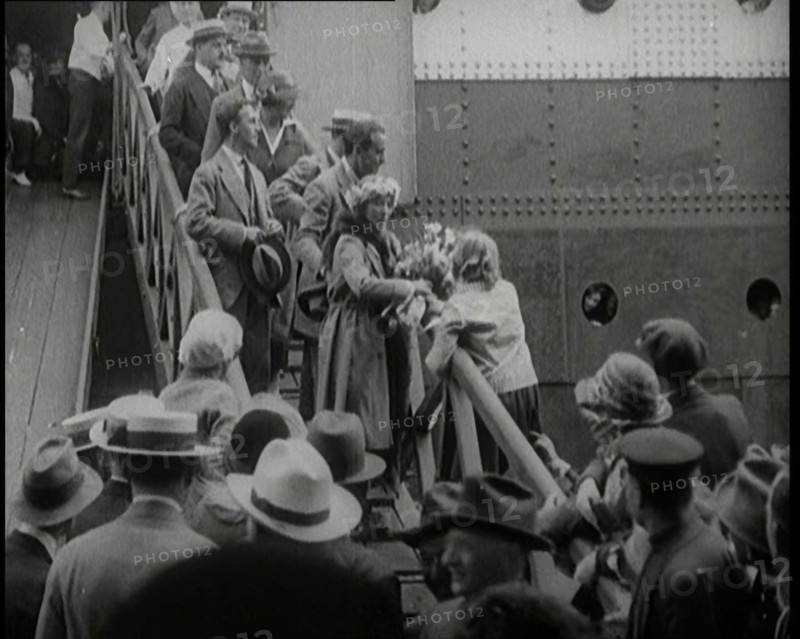 Mary Pickford and Douglas Fairbanks Senior Walking Down the Gangplank to Disembark from an..., 1920. Creator: British Pathe Ltd.