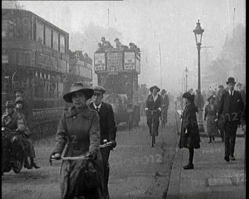 Traffic Scenes in London. Pedestrians, Cyclists, and Motorists All Passing By, 1922. Creator: British Pathe Ltd.