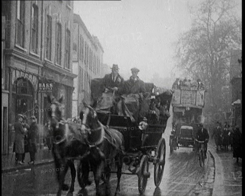 Vehicles Passing Along a Busy British Street, 1921. Creator: British Pathe Ltd.