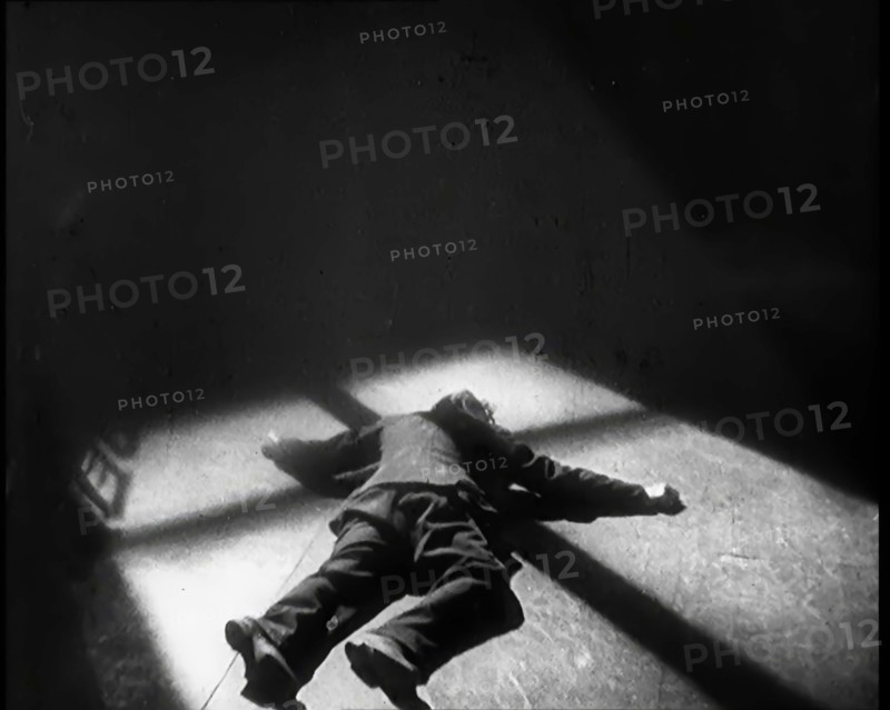 Scene from the Film 'The Informer':  Lars Hansen Falling Down Dead in a Church After..., 1920s. Creator: British Pathe Ltd.