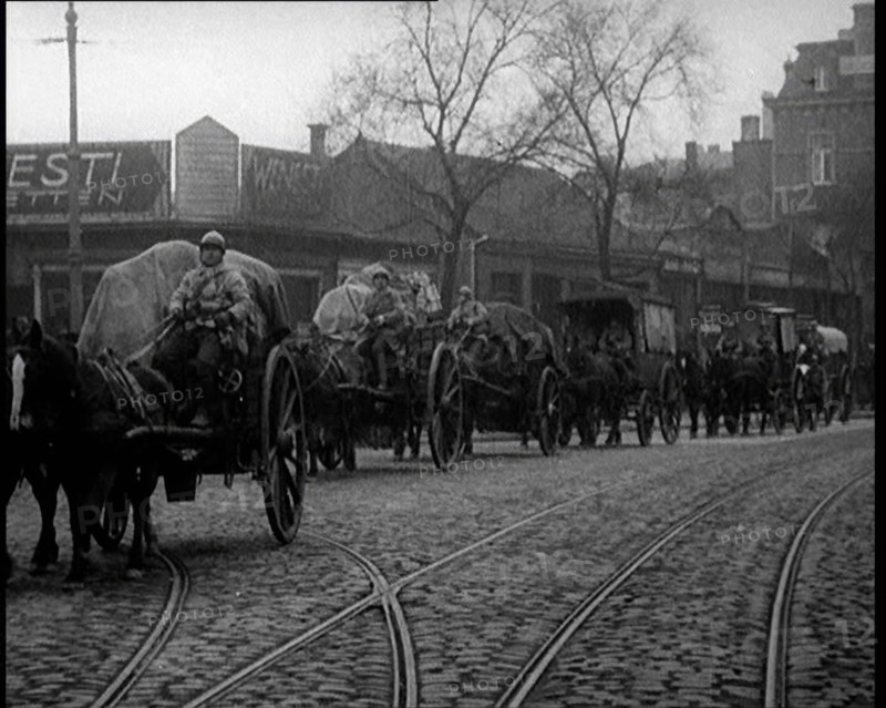 French Soldiers Escort Wagons Down a Cobbled Street, 1924. Creator: British Pathe Ltd.