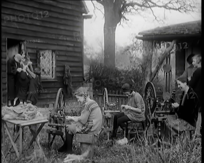 A Group of Young Girls Being Taught To Spin and Weave, 1931. Creator: British Pathe Ltd.