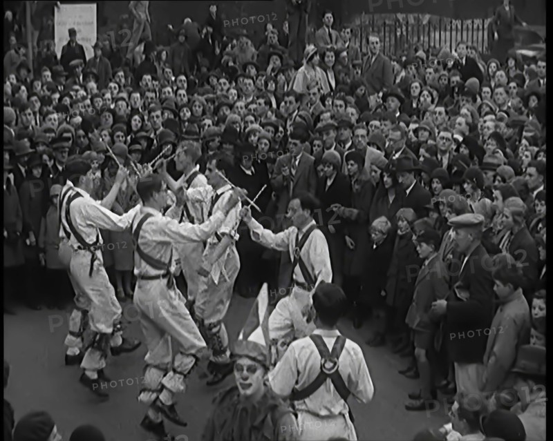 A Crowd of People Watching Morris Dancers Perform, 1931. Creator: British Pathe Ltd.