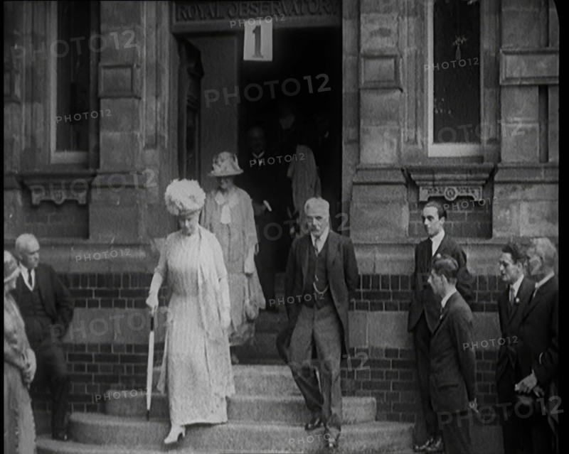 Queen Mary Accompanied by a Group of Officials Emerging from a Building , 1924. Creator: British Pathe Ltd.
