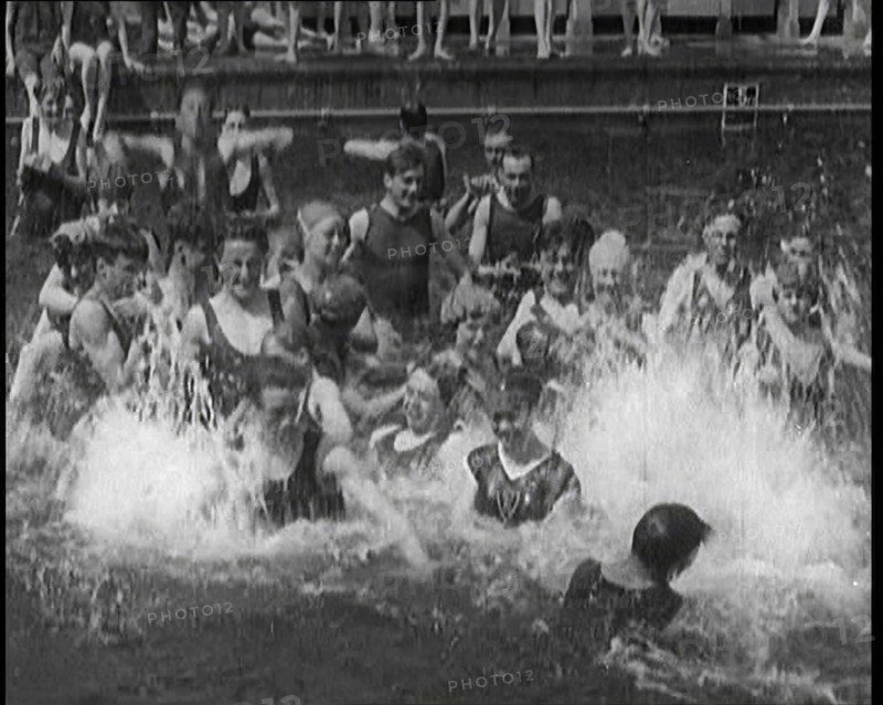 British People Splashing and Playing in the Chiswick Open Air Baths, 1920. Creator: British Pathe Ltd.