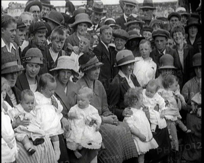 British Mothers Sitting With Their Babies on Their Laps at a Baby Show, 1920. Creator: British Pathe Ltd.