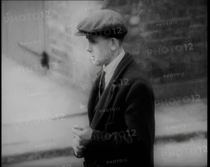 Male Civilians Standing in the Streets, 1926. Creator: British Pathe Ltd.