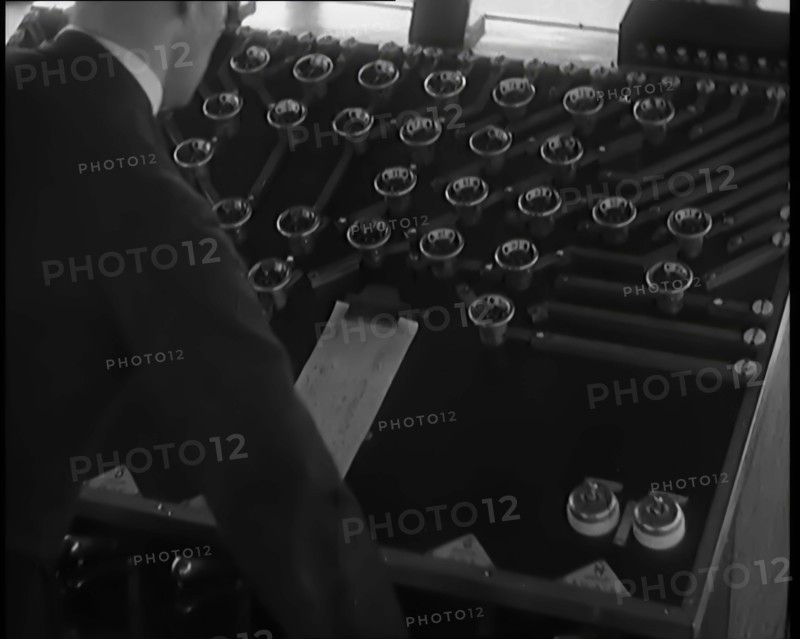 A Male Civilian Using System of Levers and Cogs To Make the Automated Railway Marshalling..., 1931. Creator: British Pathe Ltd.
